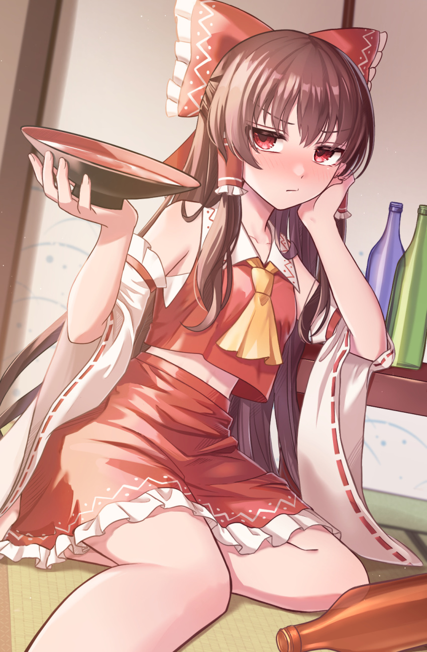 1girl ascot blush bottle bow brown_hair collared_shirt crop_top cup detached_sleeves drunk elbow_rest empty_bottle frilled_skirt frills frown hair_bow hair_tubes hakurei_reimu hand_on_own_cheek hand_on_own_face highres holding holding_cup indoors jitome long_hair long_sleeves looking_to_the_side midriff nashinome_(y5wlht) navel nose_blush on_floor red_eyes ribbon-trimmed_sleeves ribbon_trim sakazuki shirt sitting skirt skirt_set sleeveless sleeveless_shirt solo table touhou very_long_hair wide_sleeves yokozuwari