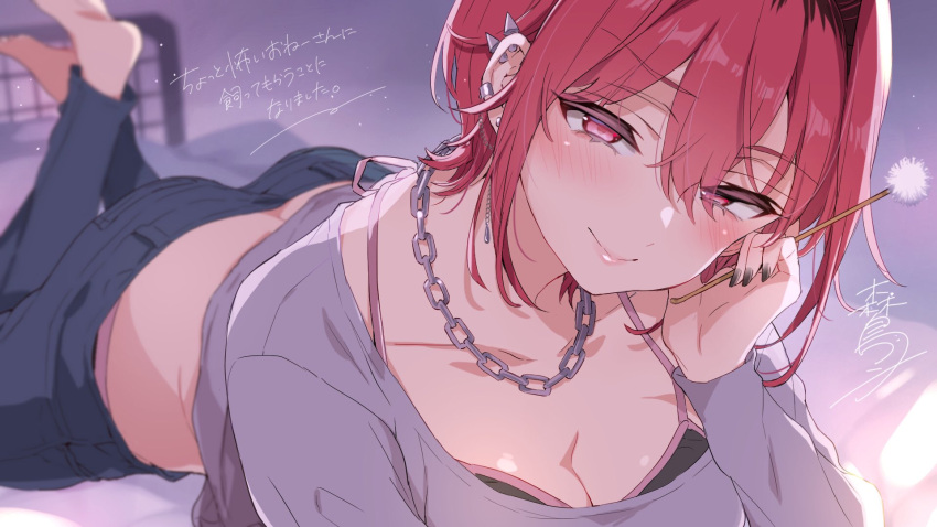 1girl ass barefoot black_bra black_nails black_pants blurry blurry_background blush bra breasts chain_necklace cleavage closed_mouth collarbone ear_piercing earrings grey_shirt hair_between_eyes highres jewelry lying mimikaki morishima_kon necklace on_bed on_stomach original pants piercing pillow red_eyes red_hair shirt signature smile solo the_pose translation_request underwear