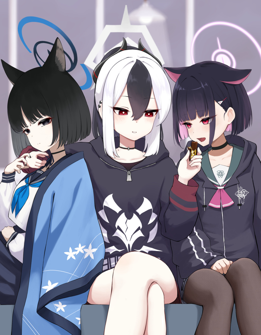 3girls absurdres animal_ears blue_archive candy cat_ears cat_girl chocolate chocolate_bar crossed_legs demon_girl demon_horns feeding food girl_sandwich halo highres holding holding_chocolate holding_food hood hoodie horns kayoko_(blue_archive) kazusa_(blue_archive) kikyou_(blue_archive) multiple_girls sandwiched shiroiurushi yuri