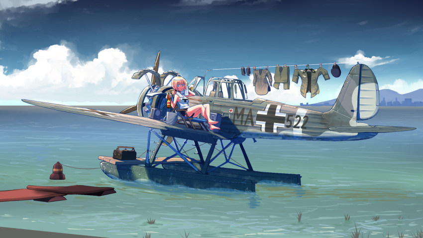 1girl aircraft airplane arado_ar_196 balkenkreuz barefoot beer_bottle black_shorts blonde_hair blue_eyes bottle bucket check_commentary clothes_pin clothes_removed cloud commentary commentary_request crossed_ankles day deck_chair drying drying_clothes erica_(naze1940) hat hat_removed headwear_removed highres holding holding_bottle horizon hot laundry looking_at_viewer low_ponytail medium_hair military military_uniform ocean original outdoors ponytail radio seaplane short_shorts shorts sitting sky sleeveless solo sunlight tank_top toolbox towel uniform water weapon wide_shot world_war_ii