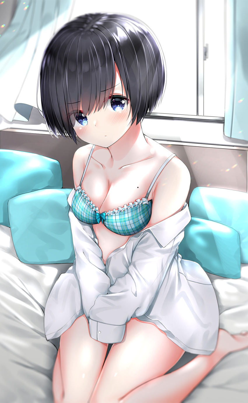 1girl bangs barefoot bed_sheet black_hair blue_bra blue_eyes blush bow bow_bra bra breasts cleavage closed_mouth collarbone collared_shirt commentary_request curtains day eyebrows_visible_through_hair frilled_bra frills highres indoors long_sleeves looking_at_viewer medium_breasts mole mole_on_breast neku_(neku_draw) off_shoulder open_clothes open_shirt original pillow plaid plaid_bra shirt short_hair sitting sleeves_past_fingers sleeves_past_wrists soles solo sunlight underwear wariza white_shirt window