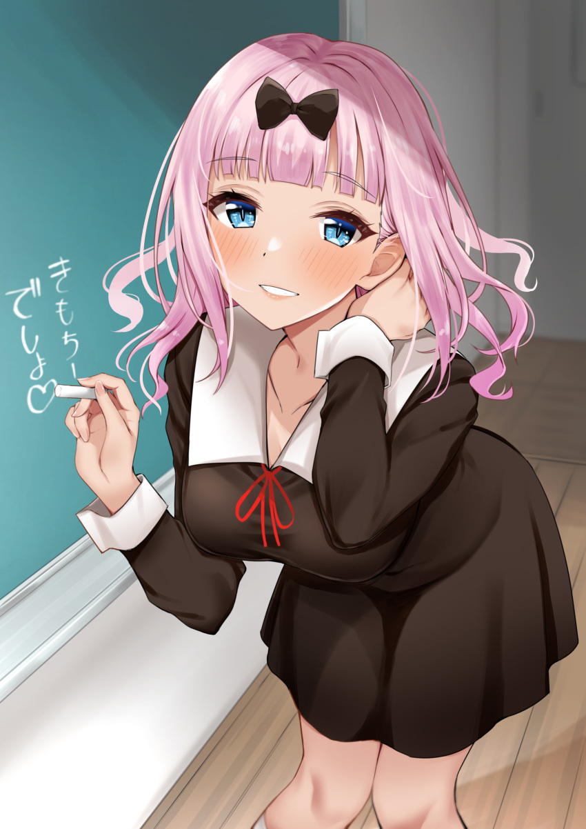 1girl absurdres bangs black_bow black_dress blue_eyes blunt_bangs blush bow breasts chalk chalkboard collarbone commentary_request dress eyebrows_visible_through_hair feet_out_of_frame fujiwara_chika hair_bow heart highres holding kaguya-sama_wa_kokurasetai_~tensai-tachi_no_renai_zunousen~ kitaku_jikan_(ktk_jkn) large_breasts leaning_forward long_hair long_sleeves looking_at_viewer parted_lips pink_hair red_ribbon ribbon school_uniform smile solo standing translation_request