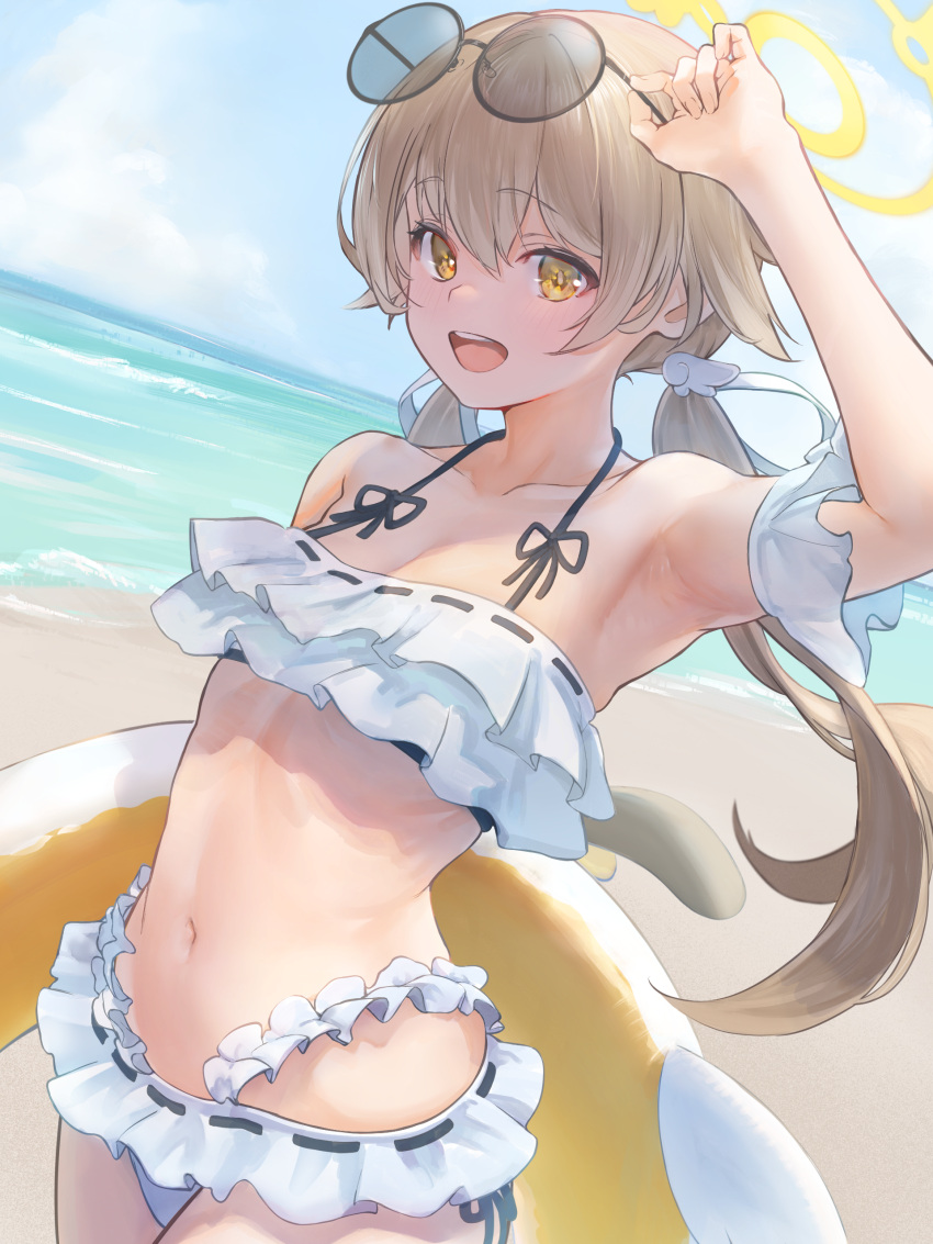 1girl absurdres bare_shoulders beach bikini blue_archive blush breasts brown_eyes collarbone eyewear_on_head frilled_bikini frills halo hifumi_(blue_archive) hifumi_(swimsuit)_(blue_archive) highres innertube light_brown_hair long_hair looking_at_viewer low_twintails marulire navel off-shoulder_bikini off_shoulder open_mouth ribbon-trimmed_bikini round_eyewear shore small_breasts smile solo sunglasses swim_ring swimsuit twintails white_bikini wing_hair_ornament