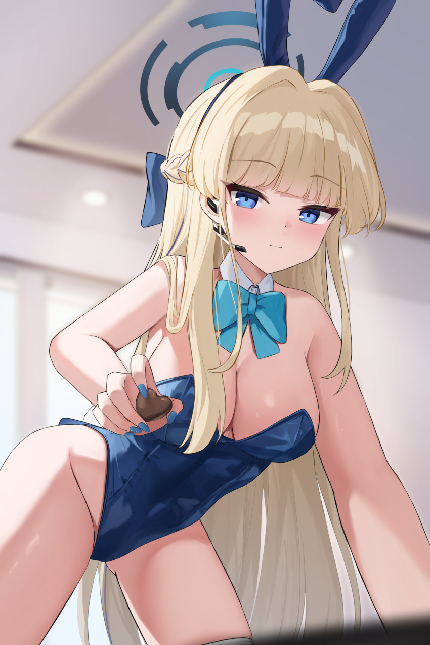 1girl absurdres animal_ears blonde_hair blue_archive blue_eyes blue_halo blue_leotard blush braid breasts chocolate closed_mouth cowboy_shot detached_collar fake_animal_ears food groin halo highres holding holding_chocolate holding_food leotard long_hair looking_at_viewer medium_breasts namoho82 official_alternate_costume rabbit_ears solo strapless strapless_leotard thighhighs toki_(blue_archive) toki_(bunny)_(blue_archive) white_thighhighs