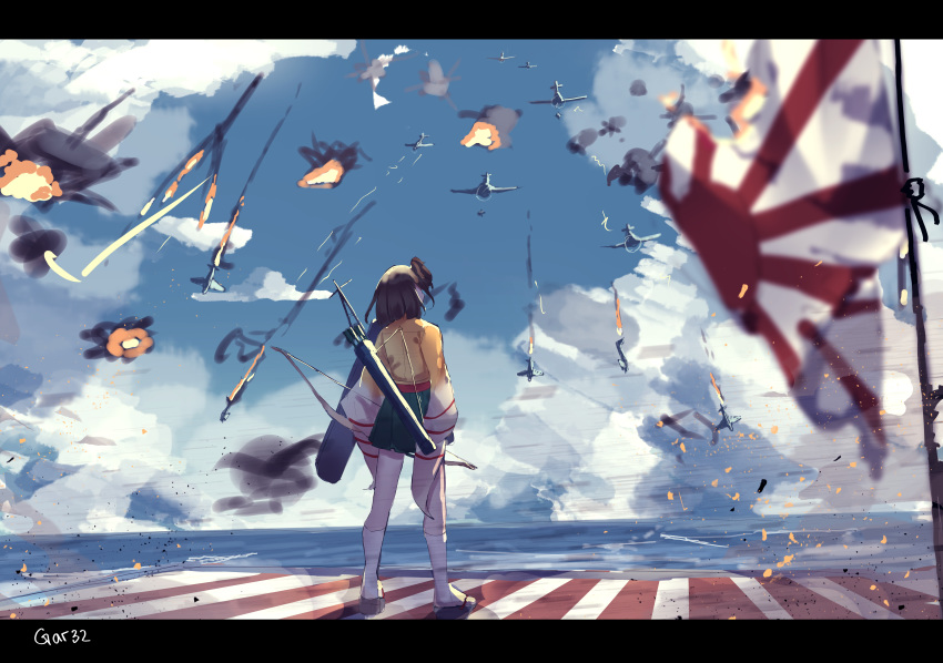1girl absurdres aircraft airplane arrow_(projectile) black_footwear black_hair blue_sky blurry blurry_foreground bow_(weapon) burning cloud commentary day depth_of_field english_commentary facing_away fire green_hakama hakama hakama_skirt highres hiryuu_(aircraft_carrier) hiryuu_(kantai_collection) horizon huge_filesize japanese_clothes kantai_collection kimono kneehighs letterboxed ocean one_side_up outdoors quiver rising_sun signature sky solo standing sunburst tattered_flag tegar32 torn_flag war water weapon white_legwear yellow_kimono zouri