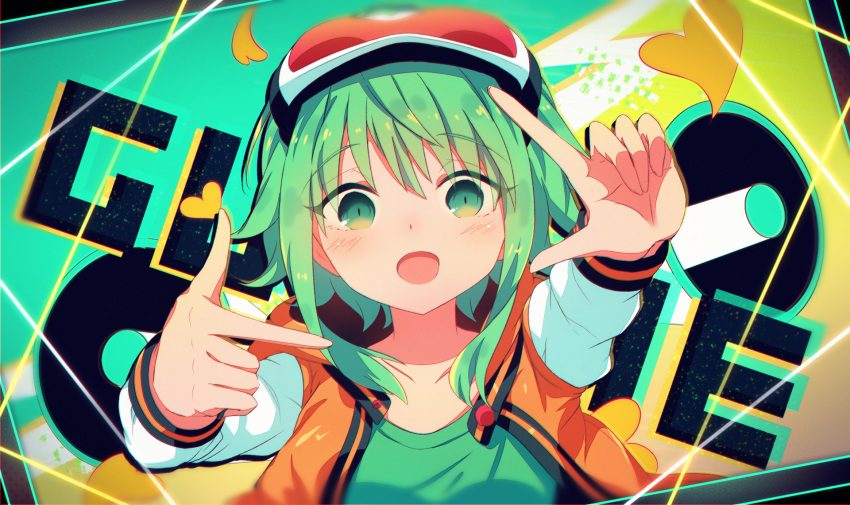 1girl arms_up bangs blush collarbone eyebrows_visible_through_hair finger_frame goggles goggles_on_head green_background green_eyes green_hair green_shirt gumi heart heart_background highres jacket long_sleeves looking_at_viewer multicolored multicolored_background open_mouth orange_background orange_jacket sakakidani shirt short_hair sidelocks smile solo upper_body vocaloid