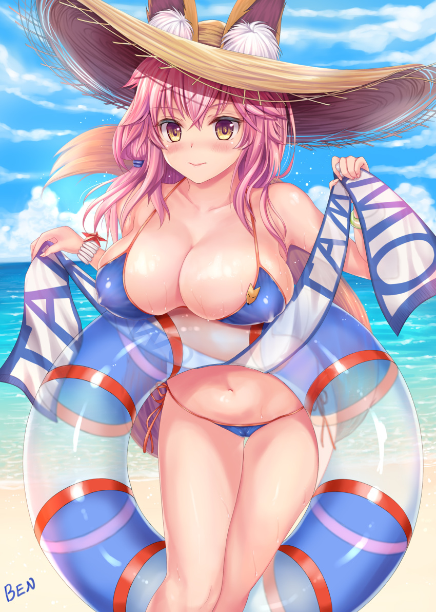 1girl animal_ear_fluff animal_ears bangs bare_shoulders beach ben bikini blue_bikini blue_sky blush breasts cleavage collarbone ears_through_headwear fate/grand_order fate_(series) fox_ears fox_girl fox_tail hat highres innertube large_breasts long_hair looking_at_viewer navel ocean pink_hair sky smile straw_hat swimsuit tail tamamo_(fate)_(all) tamamo_no_mae_(swimsuit_lancer)_(fate) thighs yellow_eyes