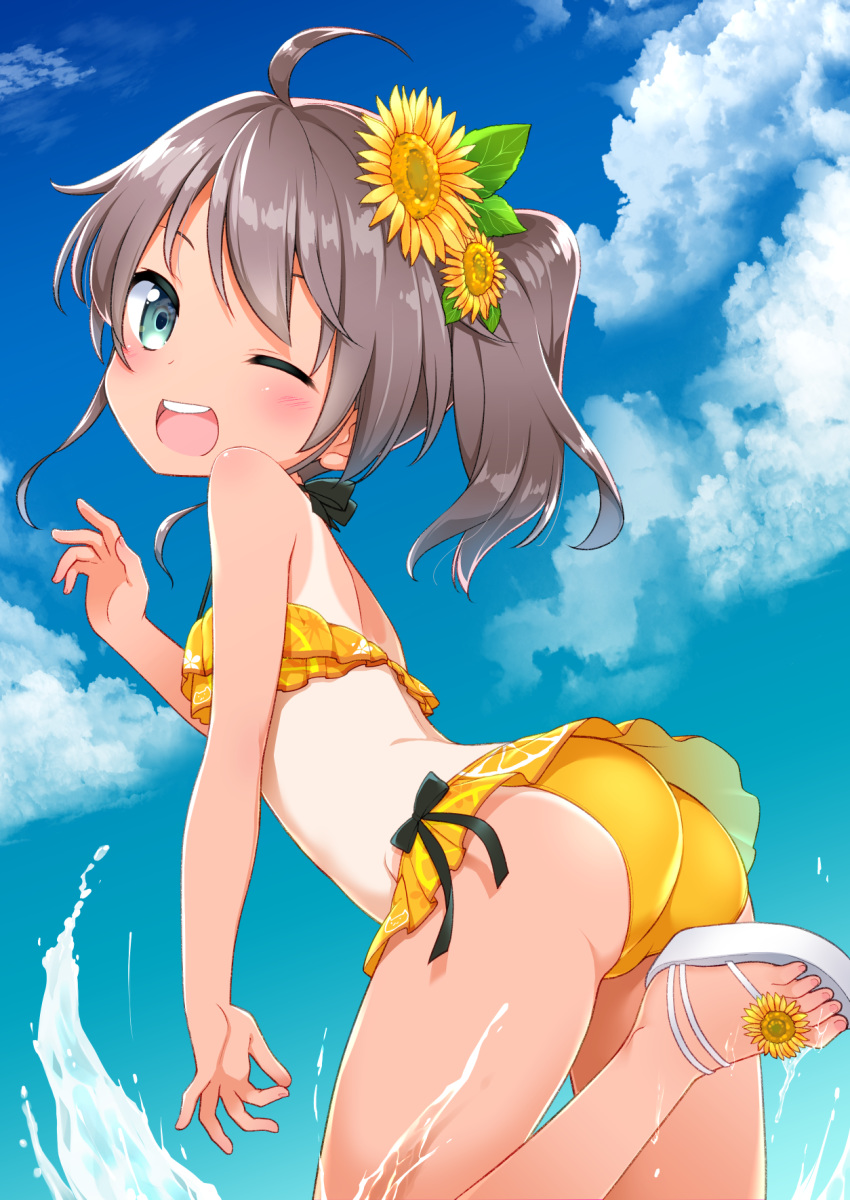 1girl ;d ahoge ass back bangs bikini black_bow blue_eyes blue_sky blush bow brown_hair cloud day flower hair_flower hair_ornament halter_top halterneck highres hololive kannazuki_genshi long_hair looking_at_viewer looking_back natsuiro_matsuri one-piece_tan one_eye_closed open_mouth outdoors sandals side_ponytail sky smile solo sunflower swimsuit tan tanline upper_teeth virtual_youtuber water yellow_bikini