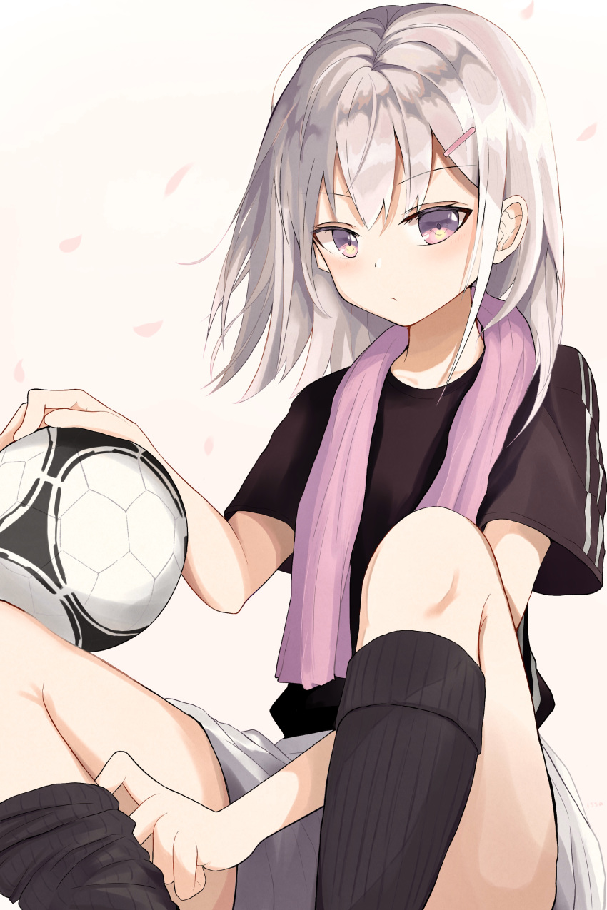 1girl 1ssakawaguchi absurdres ball bangs black_legwear collarbone commentary_request expressionless grey_hair hair_ornament hairclip highres holding holding_ball kneehighs kneehighs_pull looking_at_viewer medium_hair original petals purple_eyes short_sleeves shorts sitting soccer soccer_ball soccer_uniform solo sportswear thighs white_shorts yellow_background