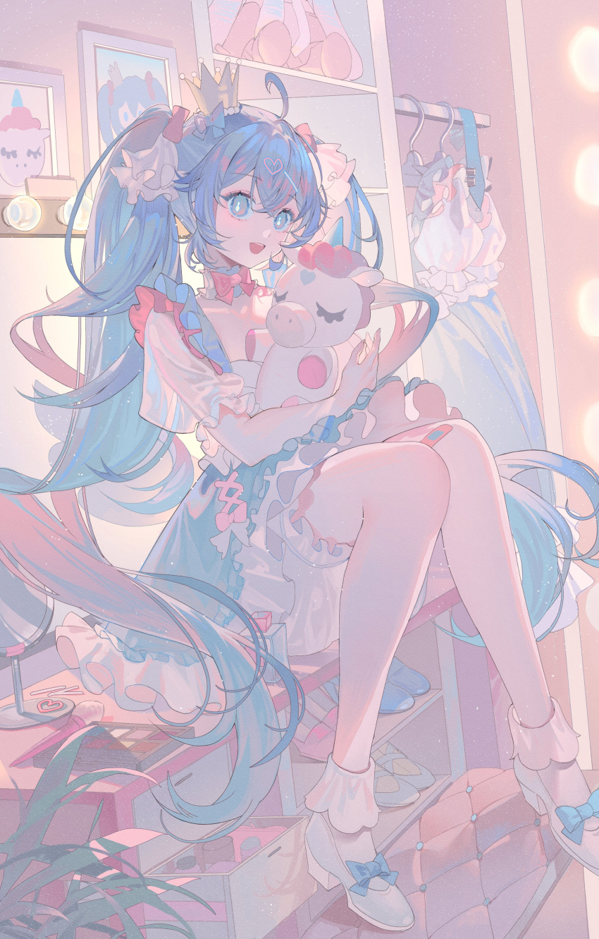 1girl :d absurdres ahoge bandaid bandaid_on_leg blue_eyes blue_hair blue_skirt blush bow bowtie closet crossed_bangs crown detached_collar dot_nose dressing_room frilled_skirt frills full_body hair_between_eyes hair_ornament hair_ribbon hatsune_miku heart heart_hair_ornament high_heels highres holding holding_stuffed_toy hugging_object indoors knees_together_feet_apart long_hair long_sleeves looking_at_viewer luzi/fengli_nanzi makeup makeup_brush mini_crown open_mouth picture_frame pink_bow pink_bowtie ribbon shelf shirt sidelocks sitting skirt smile solo stuffed_toy stuffed_unicorn teeth twintails upper_teeth_only very_long_hair vocaloid white_footwear white_ribbon white_shirt