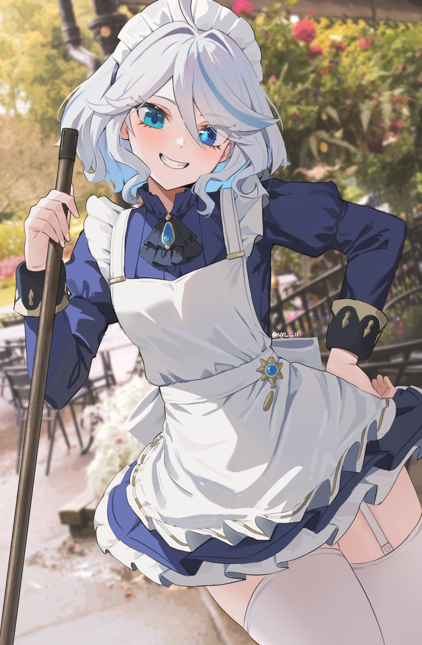 1girl absurdres ahoge apron blue_eyes blue_hair commentary cowboy_shot dutch_angle english_commentary frilled_apron frills furina_(genshin_impact) garter_straps genshin_impact grey_hair grin hair_between_eyes hand_on_own_hip heterochromia highres long_sleeves looking_at_viewer maid maid_apron maid_headdress medium_hair multicolored_hair nvl smile solo teeth thighhighs thighs twitter_username white_apron