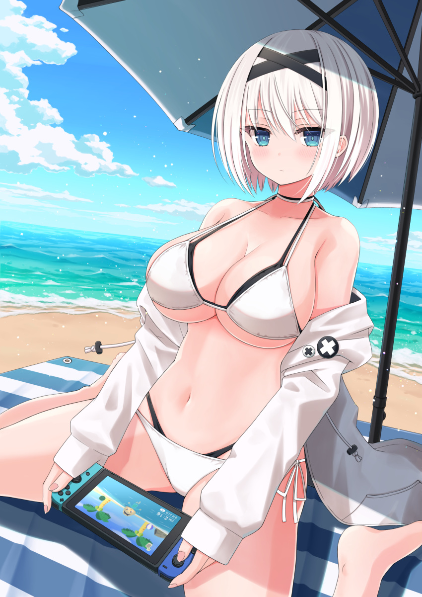 1girl bare_shoulders beach beach_mat beach_towel bikini blue_eyes breasts choker cleavage closed_mouth cloud collarbone day expressionless eyebrows_visible_through_hair hair_between_eyes hairband halterneck handheld_game_console highres jacket large_breasts layered_bikini looking_at_viewer navel nejikirio nintendo_switch ocean off_shoulder open_clothes open_jacket original outdoors sand short_hair side-tie_bikini sideboob sitting sky solo stomach string_bikini swimsuit towel umbrella underboob wariza water white_bikini white_hair white_jacket