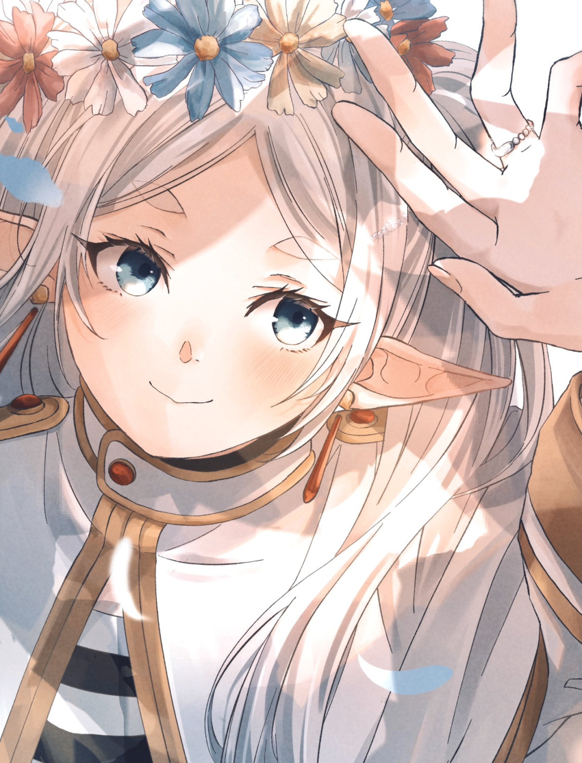 1girl arm_up blush capelet close-up commentary_request dangle_earrings dappled_sunlight earrings elf flower frieren gold_trim green_eyes hand_up head_wreath highres jewelry omichi_1219 parted_lips pointy_ears ring shirt short_eyebrows smile solo sousou_no_frieren striped_clothes striped_shirt sunlight thick_eyebrows upper_body white_capelet