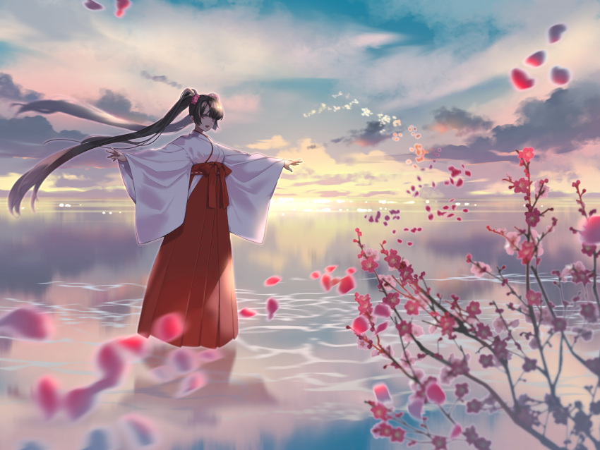 1girl absurdres black_hair cloud commentary_request flower full_body hair_flower hair_ornament hakama hakama_skirt highres horizon japanese_clothes kimono long_hair looking_at_viewer miko open_mouth original outstretched_arms petals plum_blossoms red_eyes red_hakama scenery skirt sky smile solo spread_arms sunrise taka_oedo twintails very_long_hair water white_kimono