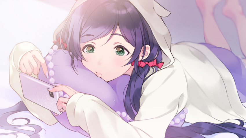 1girl animal_hood blurry blurry_background bow cellphone commentary feet_up fingernails green_eyes hair_bow holding holding_phone hood hood_up kate_iwana lips long_hair long_sleeves love_live! love_live!_school_idol_project lying nail_polish on_stomach pajamas phone pillow purple_hair purple_nails red_bow smartphone solo toujou_nozomi twintails white_hoodie