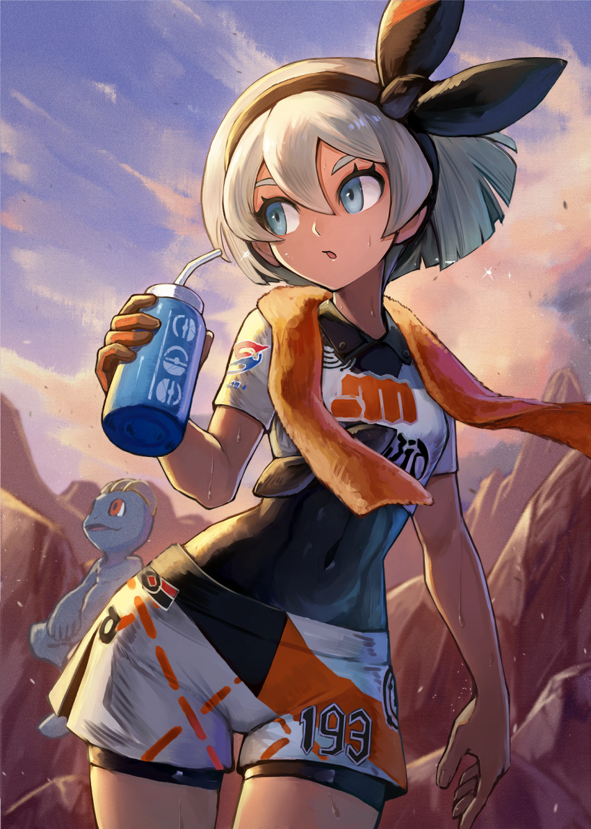 1girl :o bangs bea_(pokemon) black_hairband black_ribbon blue_eyes clothes_writing cloud covered_navel cowboy_shot crop_top day gen_1_pokemon gloves hair_between_eyes hair_ribbon hairband highres holding kuroi_susumu looking_away looking_to_the_side machop orange_gloves outdoors parted_lips pokemon pokemon_(creature) pokemon_(game) pokemon_swsh ribbon rock short_hair short_shorts short_sleeves shorts silver_hair single_glove skin_tight solo towel towel_around_neck white_shorts