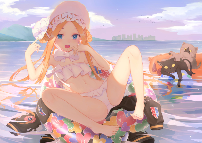 1girl abigail_williams_(fate/grand_order) abigail_williams_(swimsuit_foreigner)_(fate) absurdres bangs bare_shoulders bikini black_cat blonde_hair blue_eyes blush bonnet bow breasts cat fat123 fate/grand_order fate_(series) forehead highres innertube legs long_hair looking_at_viewer multiple_bows navel open_mouth parted_bangs sidelocks small_breasts smile spread_legs swimsuit white_bikini white_bow white_headwear