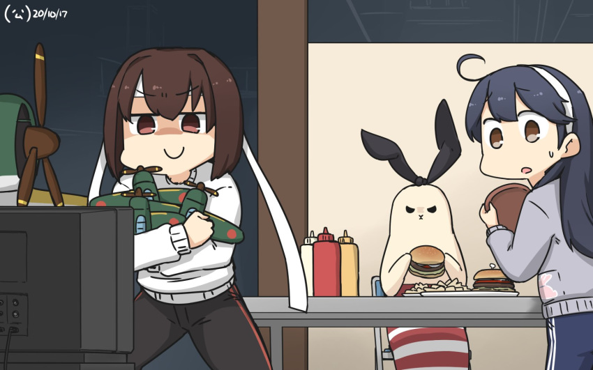 2girls ahoge aircraft airplane alternate_costume animalization black_hair black_pants blue_pants brown_eyes brown_hair commentary_request dated e16a_zuiun food grey_sweater hamburger hamu_koutarou headband highres hyuuga_(kantai_collection) kantai_collection ketchup_bottle long_hair mayonnaise_bottle multiple_girls mustard_bottle pants seal shimakaze_(kantai_collection) shimakaze_(seal) short_hair sitting smile squeeze_bottle sweater television toy track_pants tray ushio_(kantai_collection) watching_television white_headband white_sweater