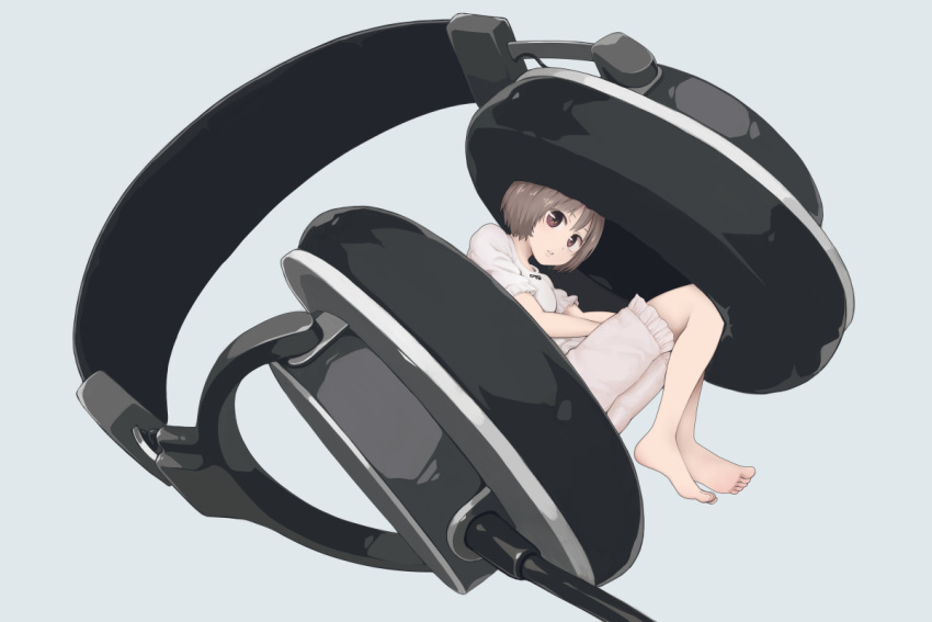 1girl brown_eyes brown_hair commentary fetal_position grey_background headphones knees_up looking_at_viewer original oversized_object shirt short_hair short_sleeves shorts simple_background solo white_shirt white_shorts yajirushi_(chanoma)