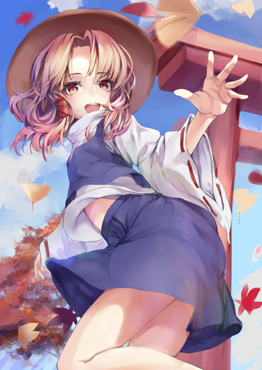 1girl arm_up asllapistone autumn autumn_leaves bangs blonde_hair blue_skirt blue_sky blue_vest brown_eyes brown_headwear cloud commentary eyebrows_visible_through_hair feet_out_of_frame folded_leg ginkgo_leaf hat high_collar highres leaf long_sleeves looking_at_viewer maple_leaf midriff_peek moriya_suwako open_mouth outdoors parted_bangs ribbon-trimmed_sleeves ribbon_trim shirt short_hair skirt sky solo standing standing_on_one_leg torii touhou tree upper_teeth vest white_shirt wide_sleeves