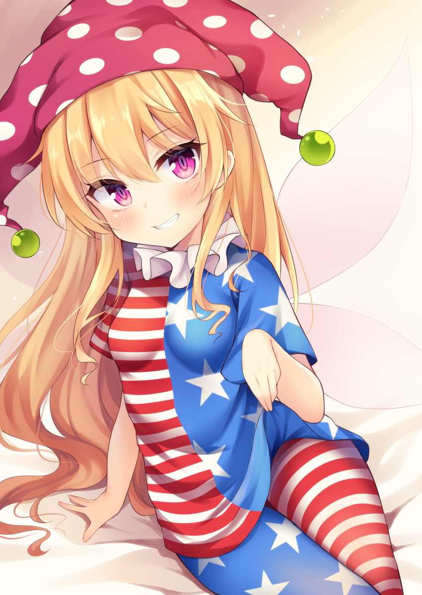 1girl absurdres american_flag_dress american_flag_legwear arm_support asymmetrical_legwear beige_background blonde_hair blush breasts clownpiece eyebrows_visible_through_hair fairy_wings gradient gradient_background grin hair_between_eyes hat highres jester_cap long_hair looking_at_viewer lying miy@ on_side pink_eyes polka_dot red_headwear red_stripes sidelocks simple_background small_breasts smile solo star_(symbol) star_print touhou upper_body wings