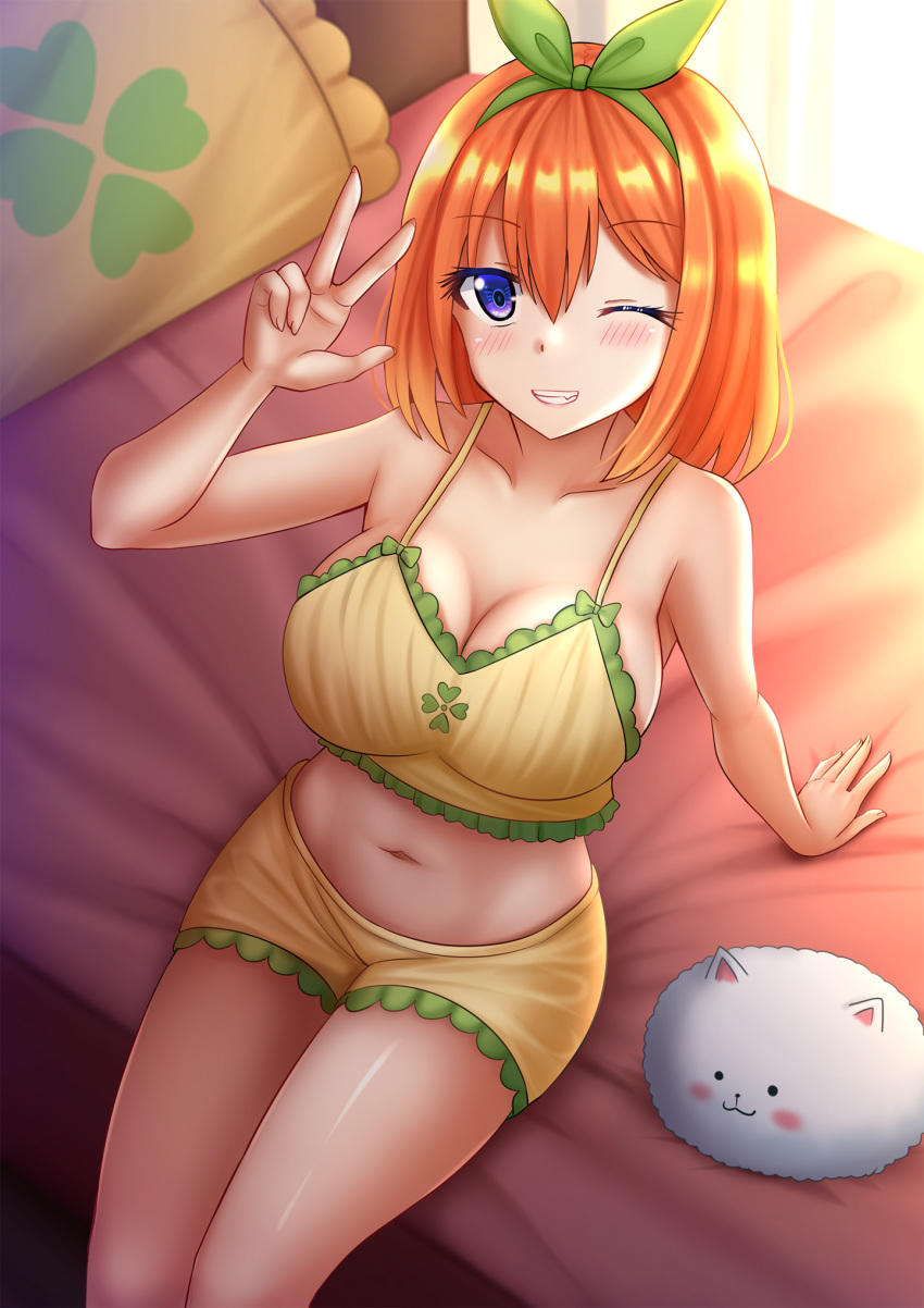 1girl arm_support bangs bare_arms bare_shoulders blush breasts cleavage collarbone commentary crop_top crossover curtains day eyebrows_visible_through_hair fang frilled_pillow frills from_above go-toubun_no_hanayome gochuumon_wa_usagi_desu_ka? green_ribbon grin hair_between_eyes hair_ribbon hand_up highres indoors kazenokaze large_breasts midriff nail_polish nakano_yotsuba navel on_bed one_eye_closed orange_hair pillow purple_eyes ribbon short_shorts shorts sitting sitting_on_bed smile sunlight tippy_(gochiusa) w yellow_nails yellow_shorts