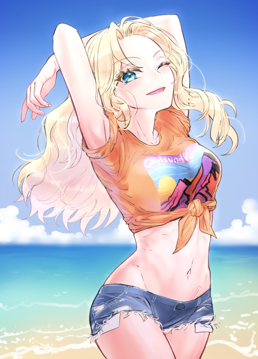 100zi 1girl arms_behind_head arms_up beach blonde_hair blue_eyes blue_shorts blue_sky casual commentary copyright_name cowboy_shot cutoffs day denim denim_shorts girls_und_panzer groin hair_intakes highres horizon kay_(girls_und_panzer) long_hair looking_at_viewer micro_shorts midriff navel ocean one_eye_closed orange_shirt outdoors print_shirt shirt short_sleeves shorts sky smile solo standing t-shirt tied_shirt wind