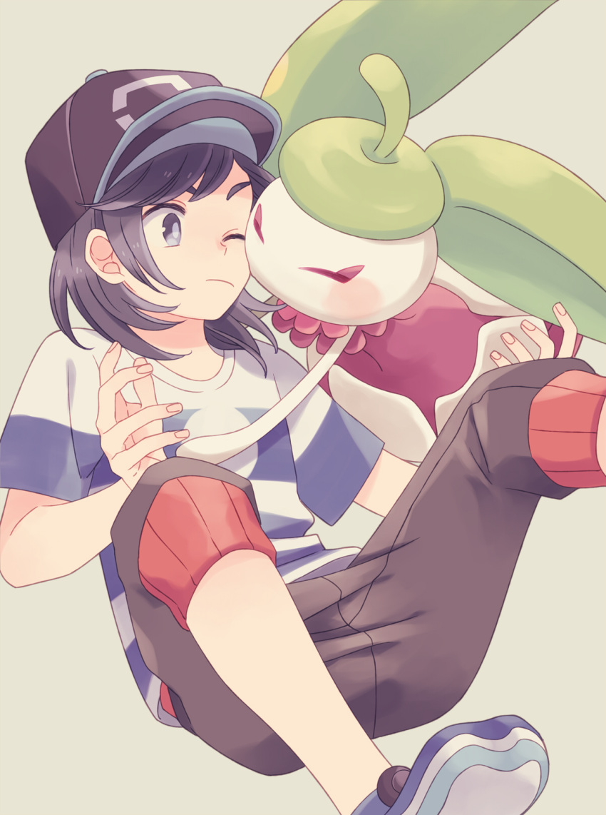 1boy bangs baseball_cap black_hair brown_pants capri_pants closed_mouth commentary_request elio_(pokemon) fingernails gen_7_pokemon grey_eyes hat highres hug komasawa_(fmn-ppp) legs_apart male_focus one_eye_closed pants pokemon pokemon_(creature) pokemon_(game) pokemon_sm shirt shoes short_sleeves steenee striped striped_shirt t-shirt