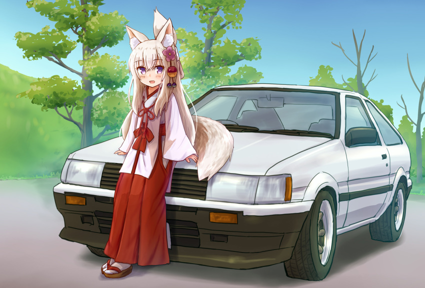 1girl :d animal_ear_fluff animal_ears bangs blush brown_footwear car commentary_request eyebrows_visible_through_hair flower folded_ponytail fox_ears fox_girl fox_tail ground_vehicle hair_between_eyes hair_flower hair_ornament hakama iroha_(iroha_matsurika) japanese_clothes kimono long_hair long_sleeves looking_at_viewer miko motor_vehicle open_mouth original purple_eyes purple_flower red_hakama sleeves_past_wrists smile socks solo tabi tail toyota_corolla_levin tree very_long_hair white_hair white_kimono white_legwear wide_sleeves zouri