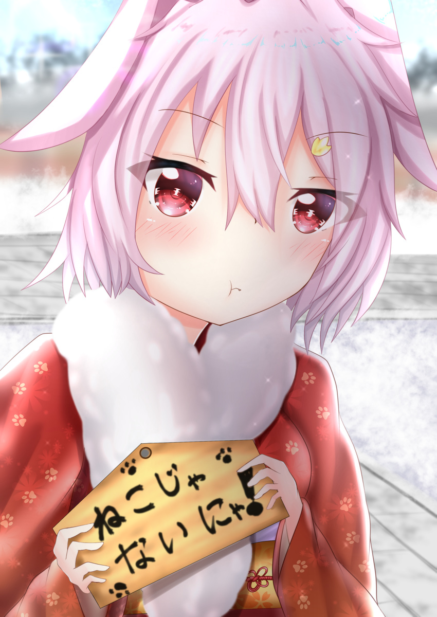 1girl :t absurdres day eyebrows_visible_through_hair fur_collar hatsumoude highres holding japanese_clothes kantai_collection kimono new_year outdoors paw_print petit_rinka pink_hair pout print_kimono red_eyes red_kimono red_ribbon ribbon short_hair solo tama_(kantai_collection) upper_body