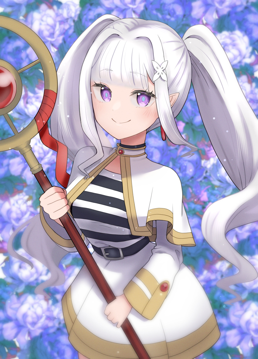 1girl 69_illust absurdres blurry blurry_background blush capelet closed_mouth commentary_request cosplay dangle_earrings depth_of_field drop_earrings earrings elf emilia_(re:zero) flower frieren hair_ornament highres holding holding_staff jewelry long_hair long_sleeves looking_at_viewer mage_staff nemophila_(flower) pointy_ears purple_eyes re:zero_kara_hajimeru_isekai_seikatsu shirt sidelocks smile solo sousou_no_frieren staff striped_clothes striped_shirt twintails white_capelet white_hair x_hair_ornament