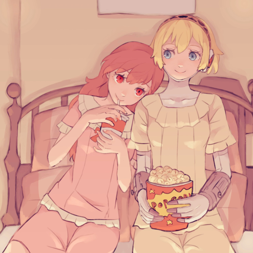 2girls aegis_(persona) android blonde_hair blue_eyes closed_mouth commentary couple cup disposable_cup drink drinking drinking_straw food hair_between_eyes hair_down head_on_another's_shoulder highres holding holding_cup holding_drink indoors joints leaning_on_person leaning_to_the_side long_hair looking_at_another multiple_girls on_bed pajamas persona persona_3 persona_3_portable popcorn red_eyes red_hair robot_joints shiomi_kotone short_hair short_sleeves side-by-side sitting smile symbol-only_commentary tbjj1208 yuri