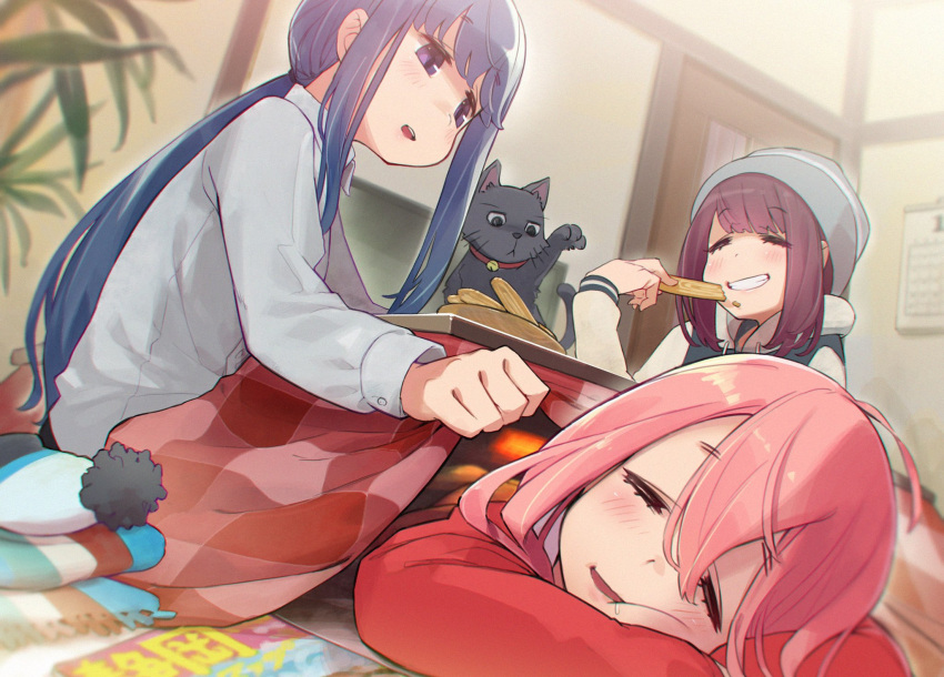 3girls animal bangs beanie black_hair blush cat commentary drooling eyebrows_visible_through_hair grin hat highres hood hoodie kagamihara_nadeshiko kotatsu long_hair lying minawa multiple_girls on_stomach plant ponytail potted_plant purple_eyes purple_hair scarf scarf_removed shima_rin smile table toki_ayano yurucamp