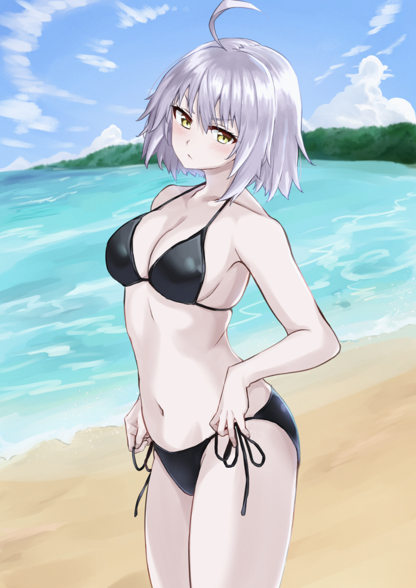 1girl bangs bare_shoulders beach bikini black_bikini blush breasts cleavage collarbone fate/grand_order fate_(series) highres jeanne_d'arc_(alter)_(fate) jeanne_d'arc_(fate)_(all) kohaku_teru large_breasts looking_at_viewer navel shore silver_hair swimsuit thighs yellow_eyes