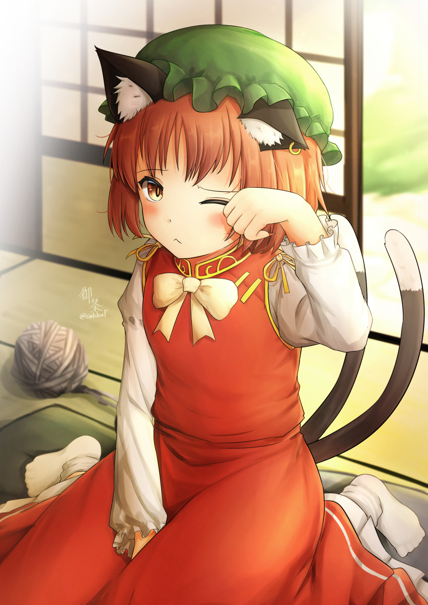 1girl ;&lt; ;3 absurdres animal_ear_fluff animal_ears blush bow bowtie brown_eyes brown_hair cat_ears cat_tail chen day dress earrings flat_chest gold_trim hand_up hat highres indoors jewelry juliet_sleeves long_sleeves looking_at_viewer mob_cap multiple_tails nekomata one_eye_closed puffy_sleeves red_dress short_hair single_earring sitting solo tail tatami touhou two_tails wariza yarn yarn_ball yu_cha