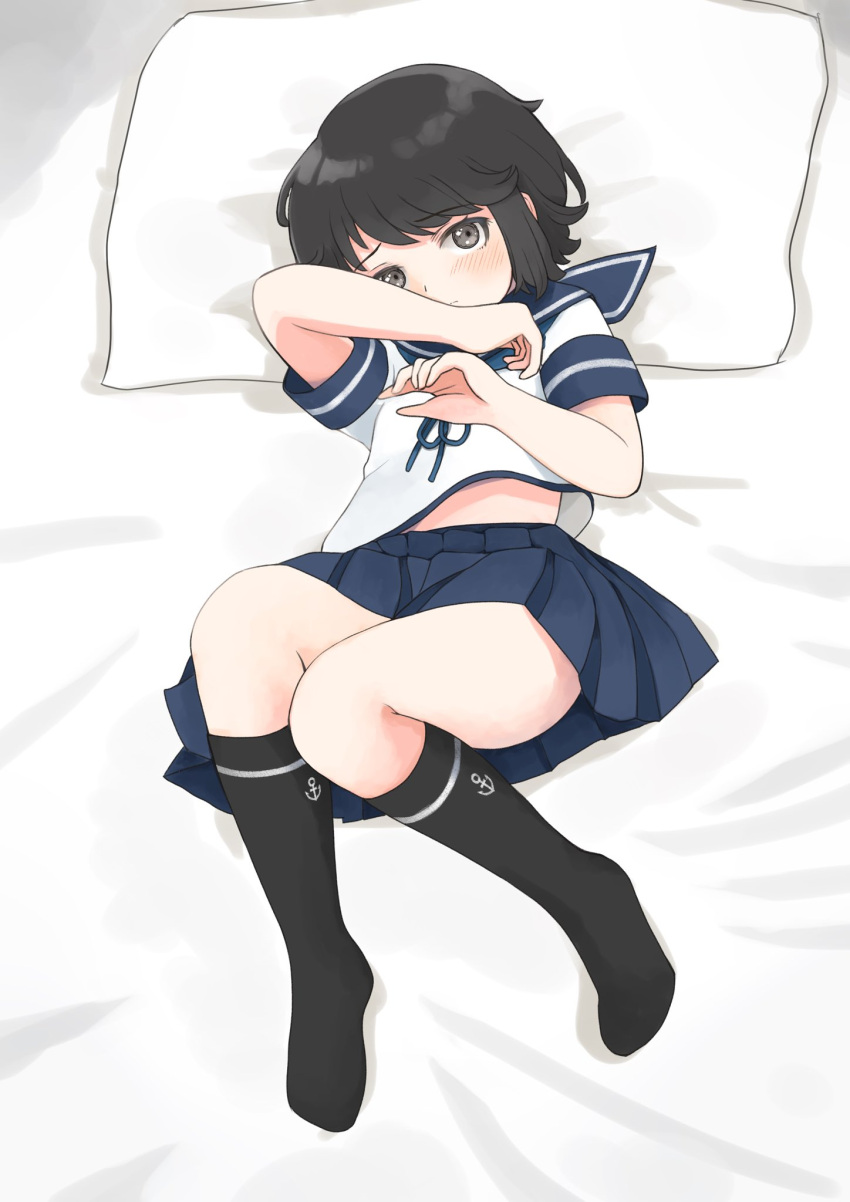 1girl black_hair black_legwear blue_sailor_collar blue_skirt brown_eyes highres kantai_collection kneehighs looking_at_viewer lying miyuki_(kancolle) pillow pleated_skirt sailor_collar school_uniform serafuku short_hair skirt solo toplow wavy_hair