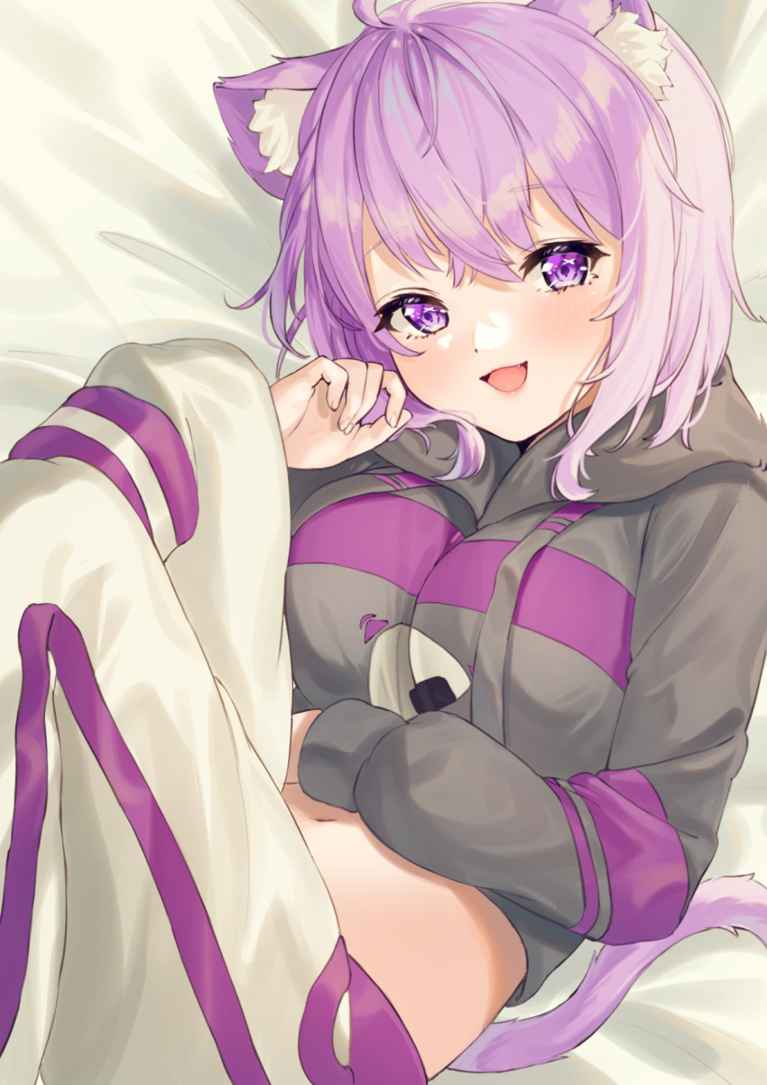 1girl :d ahoge animal_ear_fluff animal_ears bangs bed_sheet black_hoodie blush breasts cat_ears cat_girl cat_tail commentary cropped_hoodie drawstring eyebrows_visible_through_hair fang hand_on_own_stomach hand_up highres hiyorou hololive hood hood_down hoodie large_breasts long_sleeves looking_at_viewer lying medium_hair midriff navel nekomata_okayu on_back onigiri_print open_mouth pants purple_eyes purple_hair smile solo tail virtual_youtuber white_pants