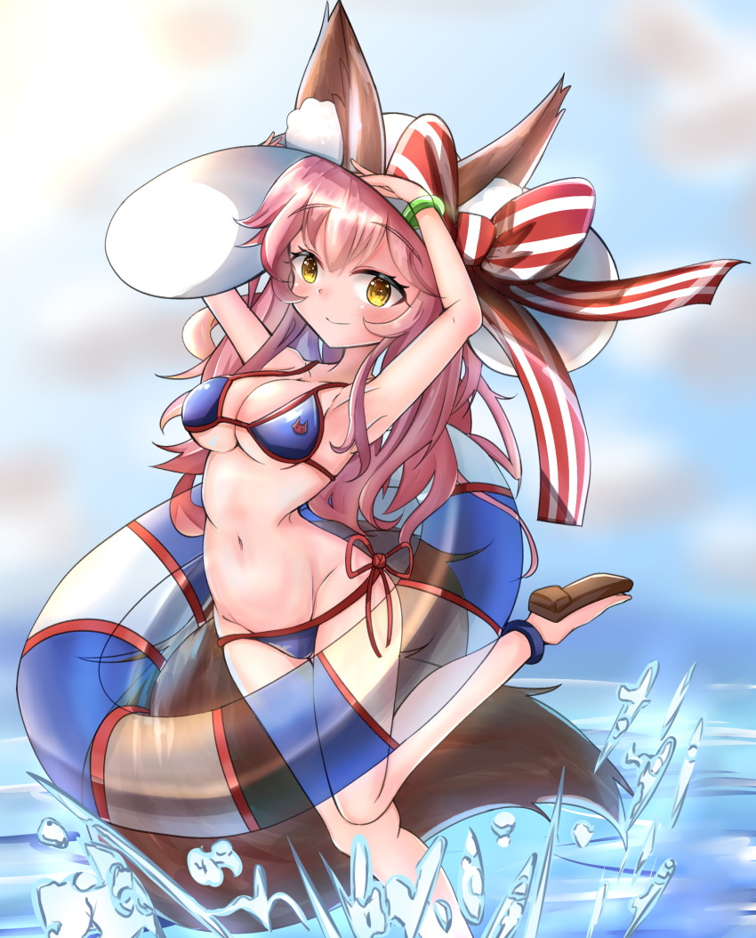 1girl animal_ear_fluff animal_ears artist_request bikini blue_sky breasts cleavage cloud collarbone day eyebrows_visible_through_hair fate/grand_order fate_(series) fox_ears fox_girl fox_tail groin hat highres horizon innertube large_breasts navel ocean outdoors pink_hair ribbon side-tie_bikini sky solo sun_hat swimsuit tail tamamo_(fate)_(all) tamamo_no_mae_(swimsuit_lancer)_(fate) water yellow_eyes