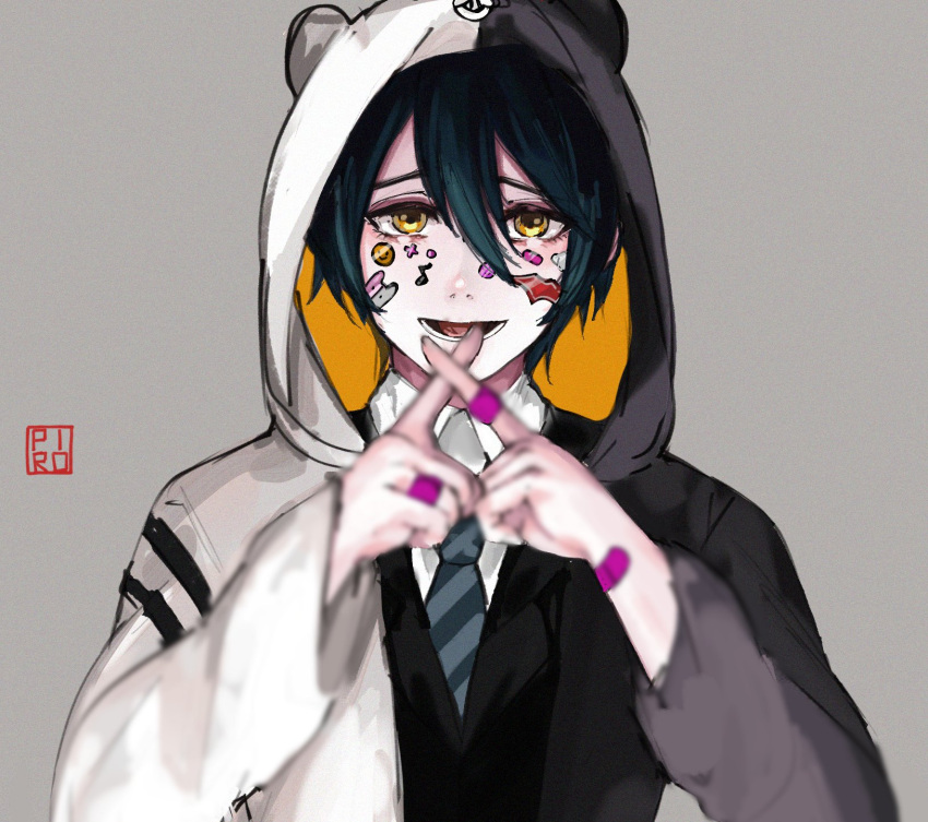 1boy animal_hood bandaid bandaid_on_hand bangs bear_hood black_hair black_jacket black_neckwear blurry blurry_foreground brown_eyes commentary cosplay danganronpa_(series) danganronpa_v3:_killing_harmony depth_of_field facepaint grey_background hair_between_eyes highres hood hood_up hoodie index_finger_raised jacket long_sleeves looking_at_viewer lower_teeth male_focus monokuma monokuma_(cosplay) necktie open_mouth pale_skin piro_(piropoi) saihara_shuuichi shirt short_hair solo sticker striped upper_body white_shirt yellow_eyes