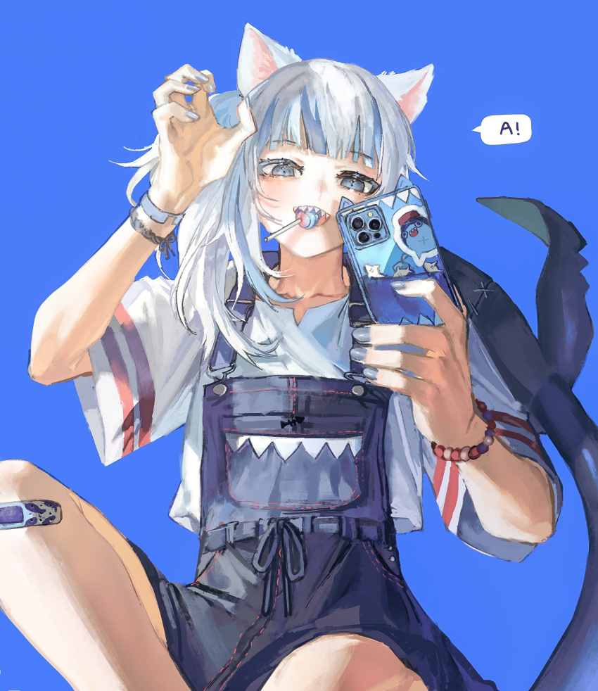 1girl a animal_ears animal_print bandaid bandaid_on_knee bandaid_on_leg bloop_(gawr_gura) blue_background blue_eyes blue_hair blue_nails blue_ribbon bracelet candy cat_ears collarbone eyelashes fingernails fish_print fish_tail food food_in_mouth gawr_gura grey_hair highres holding holding_phone hololive hololive_english jewelry light_blue_hair light_blush lollipop long_hair long_sleeves mouth_hold multicolored multicolored_hair overall_skirt phone quasarcake ribbon selfie shark_tail sharp_teeth simple_background solo speech_bubble sticker stitches streaked_hair striped tail teeth upper_teeth virtual_youtuber wide_sleeves