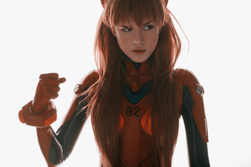 1girl absurdres backlighting blue_eyes bodysuit brown_hair clenched_hand commentary cosplay cosplay_photo english_commentary film_grain freckles hair_over_breasts highres long_hair neon_genesis_evangelion photo_(medium) plugsuit red_bodysuit reference_photo shirogane-sama sideways_glance simple_background solo souryuu_asuka_langley upper_body white_background