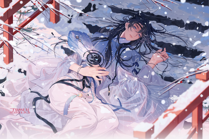 1boy absurdres apricot_flower artist_name black_hair black_headband blue_dress chinese_clothes dress hand_fan hand_in_hair headband highres holding holding_fan long_hair long_sleeves looking_at_viewer lying male_focus original pants see-through snow snowflakes snowing stairs transparent tumeii white_pants