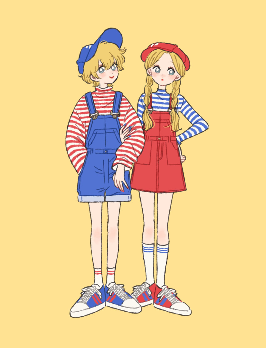 2girls baseball_cap blonde_hair blue_eyes blue_headwear blue_nails blue_overalls blue_shirt braid bubble character_request color_coordination hand_on_hip hat highres locked_arms long_sleeves matching_outfit multiple_girls overall_shorts overall_skirt overalls red_headwear red_lips red_nails red_overalls red_shirt rikuwo sanrio shirt shoes short_hair sneakers socks striped striped_legwear striped_shirt turtleneck twin_braids twintails white_shirt yellow_background