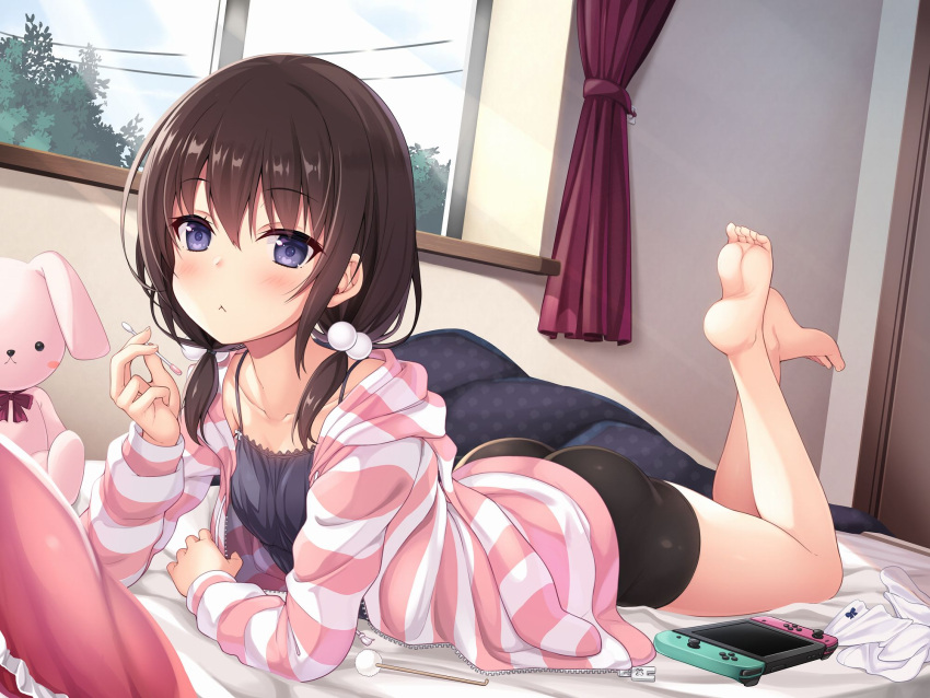 1girl :&lt; ass bangs bare_shoulders bed_sheet bike_shorts black_camisole black_shorts blanket brown_hair camisole collarbone cotton_swab curtains eyebrows_visible_through_hair feet feet_up hair_between_eyes hair_bobbles hair_ornament highres holding hood hoodie indoors light_rays looking_at_viewer lying medium_hair mimikaki nintendo_switch on_bed on_stomach original pillow power_lines purple_eyes short_twintails shorts socks socks_removed solo striped striped_hoodie stuffed_animal stuffed_bunny stuffed_toy sunbeam sunlight toes tree twintails utsurogi_akira white_legwear window