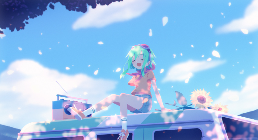 1girl car closed_eyes commentary flower goggles goggles_on_head green_hair ground_vehicle gumi highres motor_vehicle open_mouth outdoors radio red-tinted_eyewear red_goggles sakakidani short_hair_with_long_locks short_sleeves shorts sitting solo sunflower tinted_eyewear vocaloid
