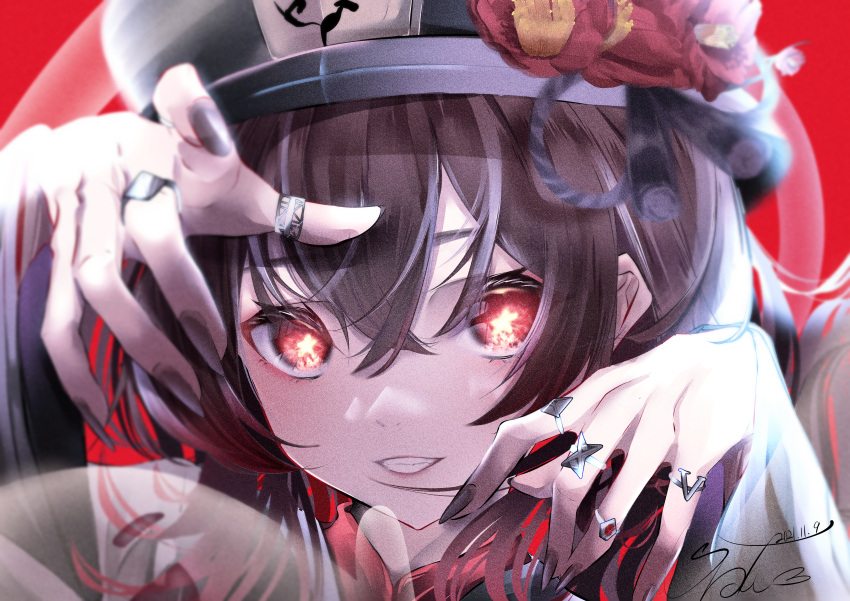 1girl absurdres black_nails breasts face fingernails fingers flower genshin_impact hands hat hat_flower highres hu_tao_(genshin_impact) jewelry long_sleeves looking_at_viewer nail_polish red_background red_eyes ring simple_background smile solo star-shaped_pupils star_(symbol) symbol-shaped_pupils teeth urotare