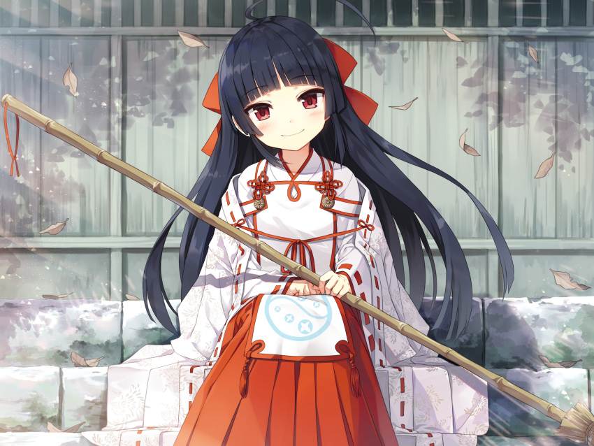 1girl ahoge ayakashi_kyoushuutan bangs black_hair blunt_bangs blush bow broom closed_mouth commentary_request cura day eyebrows_visible_through_hair feet_out_of_frame hair_bow hakama hakama_skirt head_tilt highres holding holding_broom huge_ahoge japanese_clothes leaf long_hair looking_at_viewer miko monobeno official_art outdoors red_bow red_eyes red_hakama red_ribbon ribbon ribbon-trimmed_sleeves ribbon_trim seishin_himemiya sitting skirt smile solo very_long_hair wide_sleeves wind