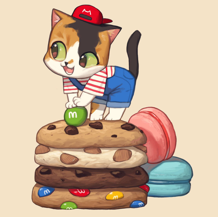 backwards_hat baseball_cap black_eyes blue_overalls brown_background cat chocolate_chip_cookie colored_sclera cookie food green_sclera hat highres leaning_forward m&amp;m's macaron no_humans open_mouth original overalls red_headwear rinotuna shadow shirt short_sleeves simple_background smile solo striped striped_shirt