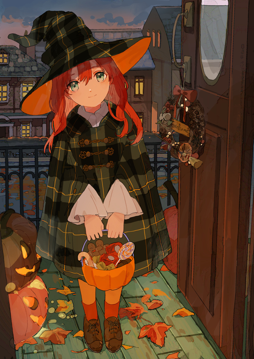 1girl absurdres autumn bangs brown_footwear closed_mouth commentary_request eyebrows_visible_through_hair green_eyes green_headwear hair_between_eyes halloween halloween_bucket hat head_tilt highres holding house jack-o'-lantern long_hair long_sleeves looking_at_viewer open_door orange_legwear original outdoors pantyhose plaid_headwear qooo003 red_hair red_legwear shoes smile socks socks_over_pantyhose solo standing sunset wide_sleeves window witch_hat wreath