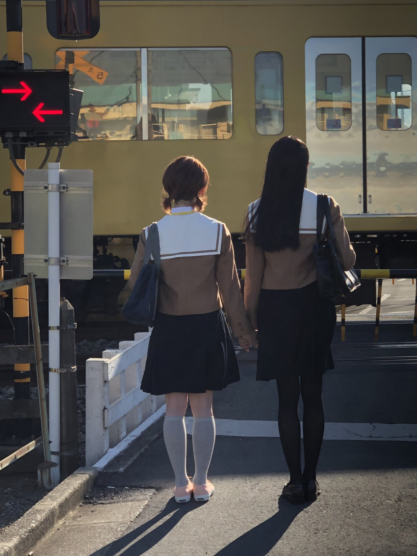 2girls artist_name bag black_hair black_pantyhose black_skirt brown_footwear brown_shirt commentary cosplay_photo from_behind highres holding_hands kneehighs koito_yuu loafers long_hair multiple_girls nanami_touko official_art orange_hair pantyhose photo_(medium) railroad_crossing real_world_location reference_photo road sailor_collar school_bag school_uniform shirt shoes short_hair short_twintails skirt socks street tohmi_higashi_high_school_uniform train twintails white_sailor_collar white_socks yagate_kimi_ni_naru yuri